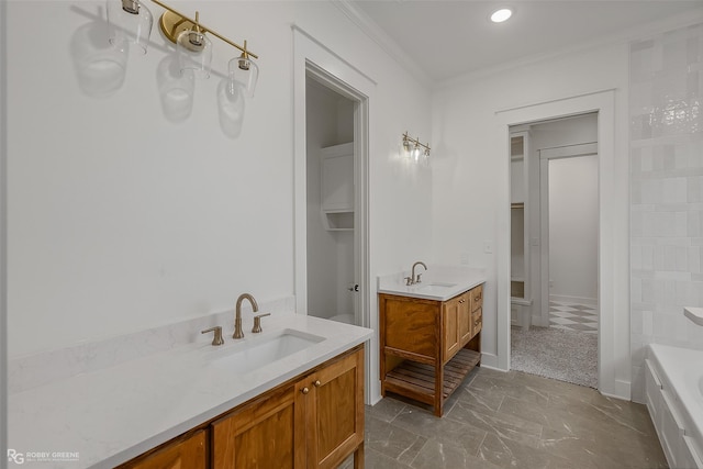 bathroom featuring vanity, a bathtub, and ornamental molding