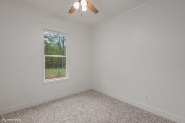 unfurnished room featuring carpet flooring, crown molding, and ceiling fan