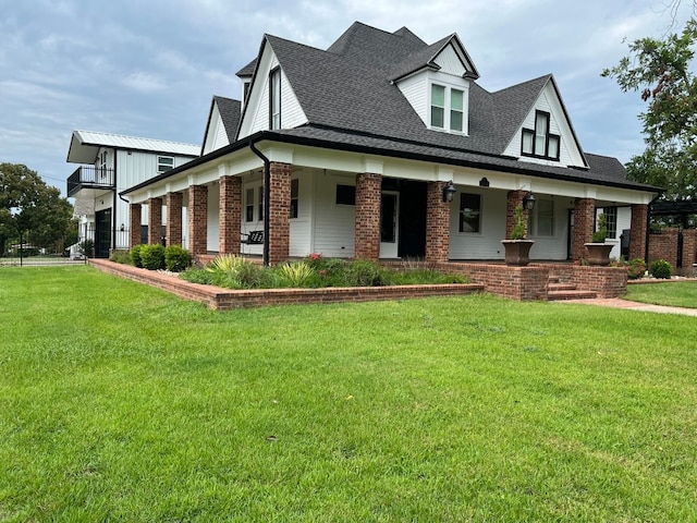 view of front of home featuring a front lawn and a porch