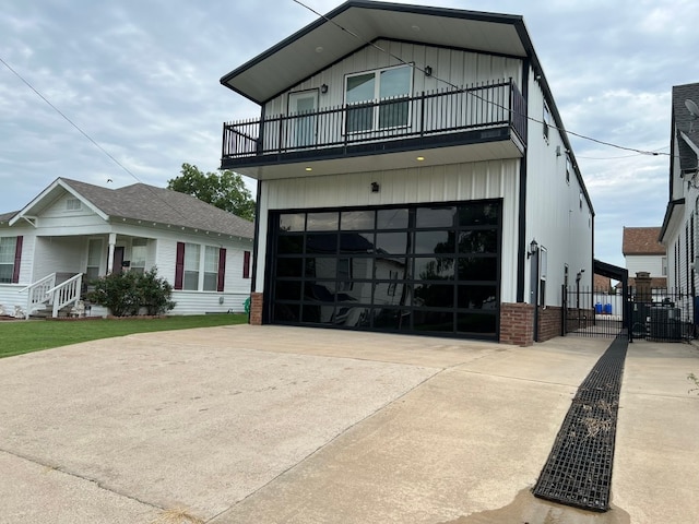 view of front facade with a balcony and a garage