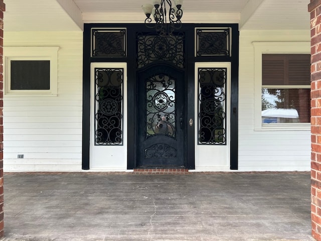 property entrance with covered porch