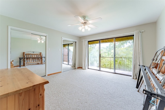 sitting room featuring light carpet and ceiling fan