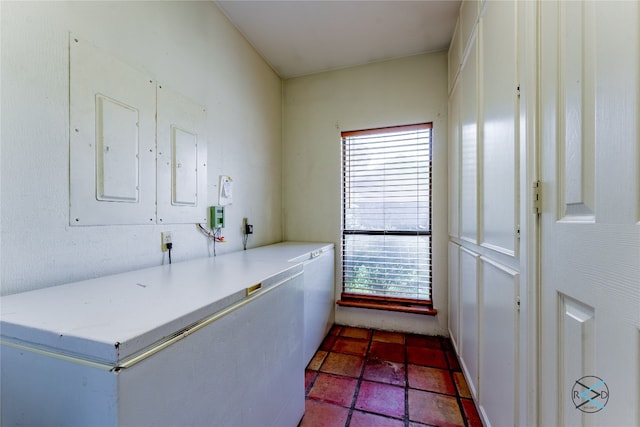 interior space with a healthy amount of sunlight and dark tile floors