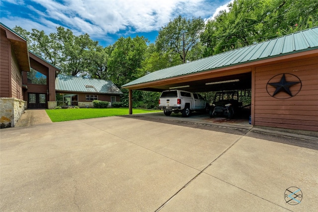 view of car parking with a carport and a lawn