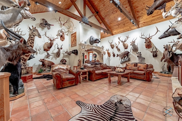 tiled living room with wooden ceiling, high vaulted ceiling, and beam ceiling