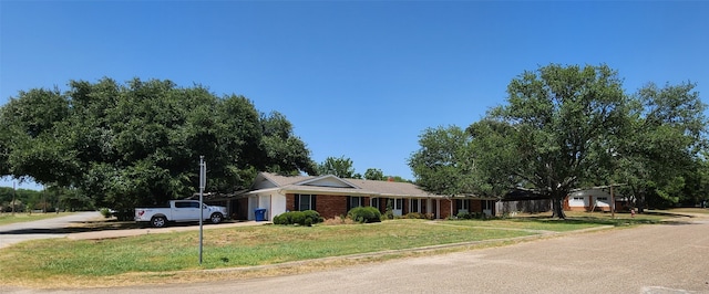 ranch-style house with a front yard