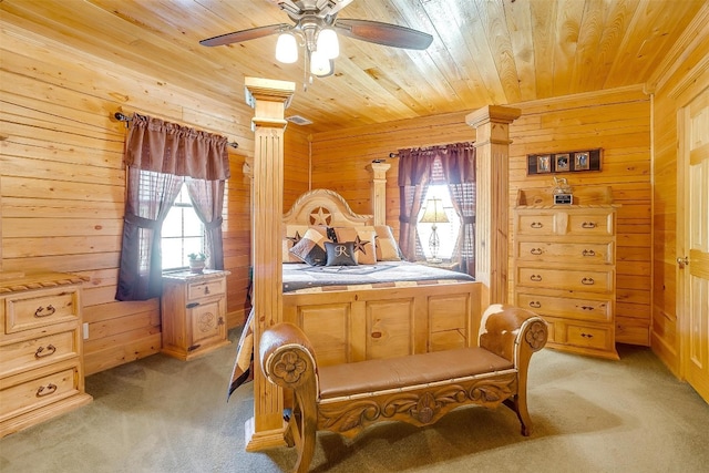 bedroom featuring wooden walls, light colored carpet, ceiling fan, and wood ceiling