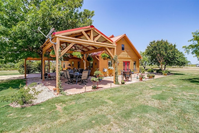 back of house featuring a patio, a gazebo, and a yard