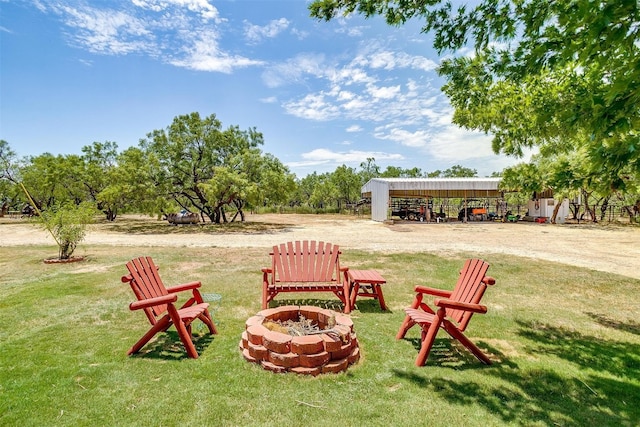 view of yard featuring an outdoor fire pit