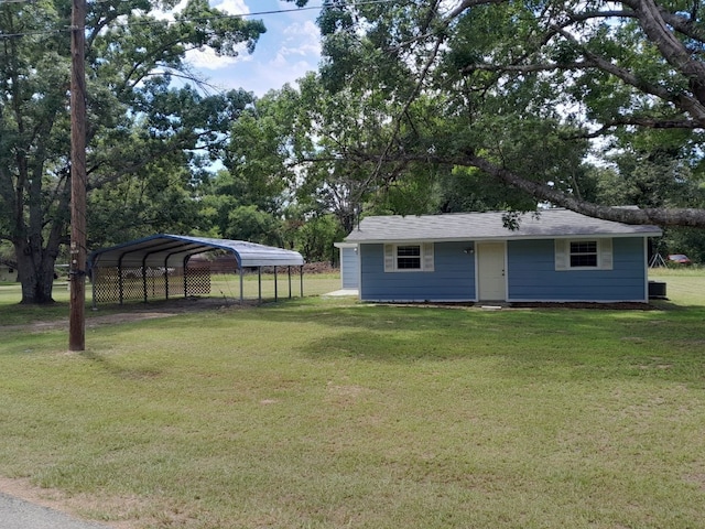 exterior space featuring a carport and a yard