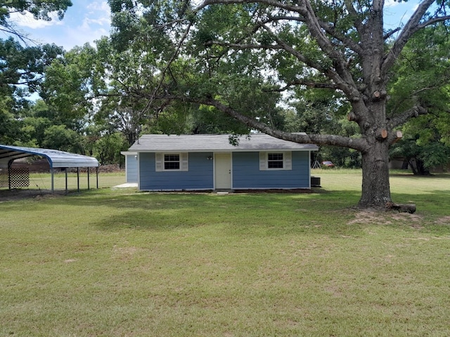 exterior space featuring a lawn and a carport