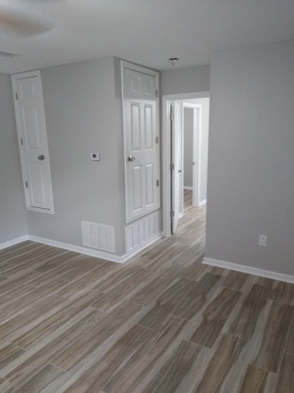 spare room with light hardwood / wood-style flooring