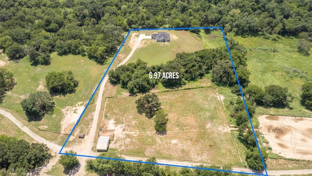 birds eye view of property with a rural view