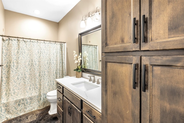 bathroom with toilet and vanity