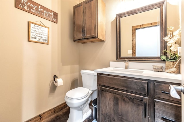 bathroom with toilet and vanity