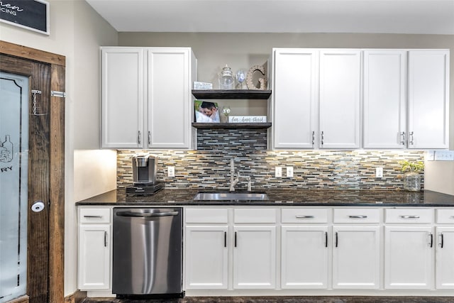 kitchen with sink, dishwasher, white cabinets, and backsplash