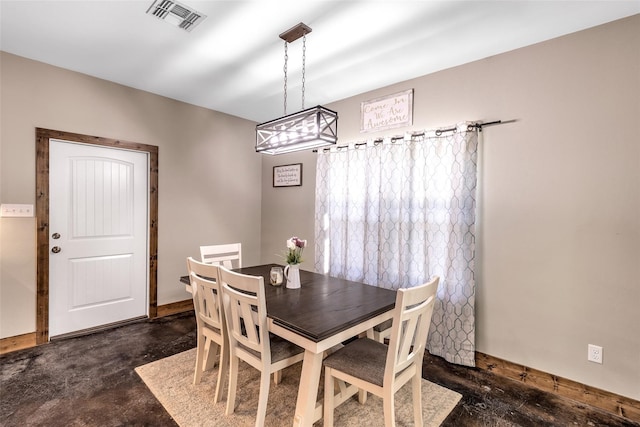 dining room featuring a chandelier