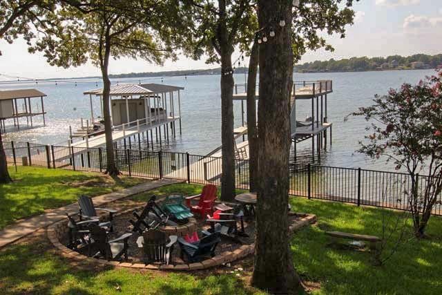 exterior space featuring a water view and fence