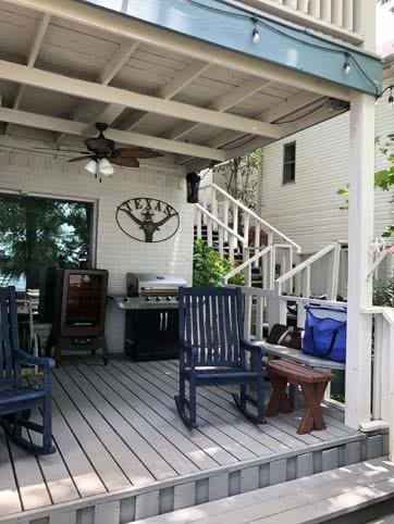 deck with stairway, grilling area, and a ceiling fan