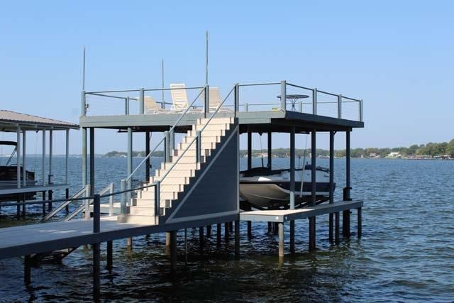 view of dock featuring a water view and boat lift