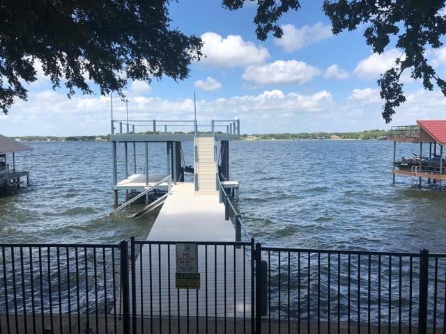 view of dock featuring a water view and boat lift