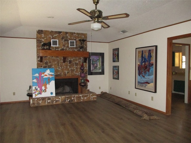 unfurnished living room with ceiling fan, dark wood-type flooring, a fireplace, a textured ceiling, and vaulted ceiling