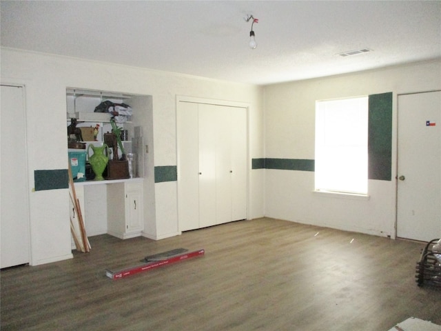 unfurnished room featuring wood-type flooring