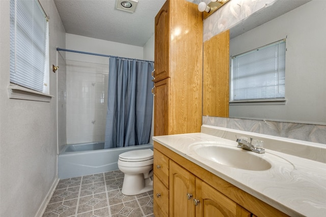 full bathroom featuring vanity, shower / bath combo, a textured ceiling, tile patterned floors, and toilet