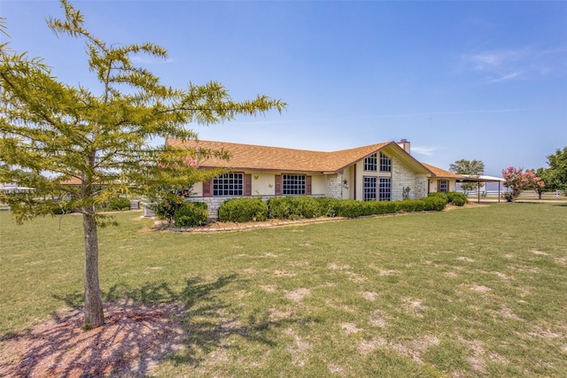 single story home featuring a front yard