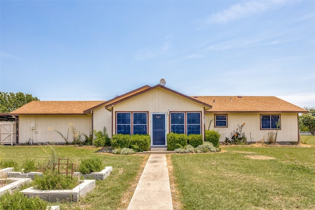 ranch-style home with a front lawn