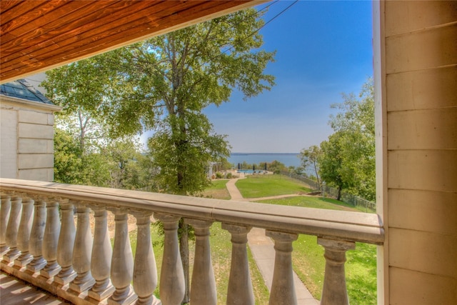 balcony featuring a water view