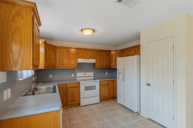 kitchen featuring white appliances, backsplash, sink, and light tile floors