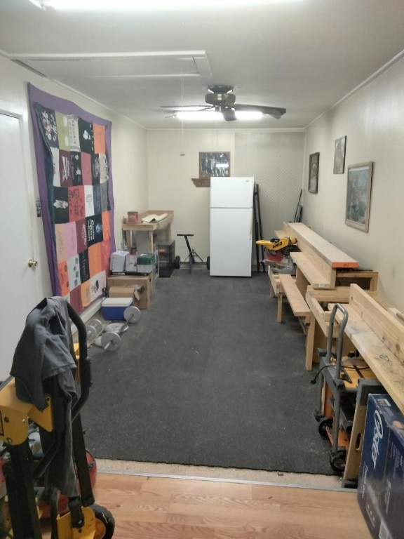 miscellaneous room with hardwood / wood-style floors and ceiling fan