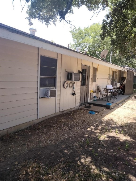 rear view of house featuring a patio