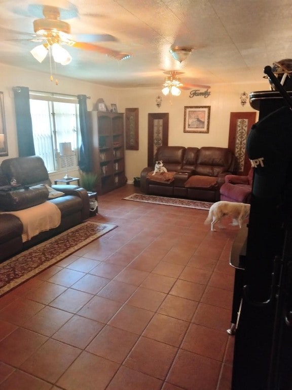 living room with ceiling fan and tile flooring