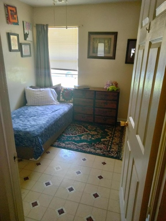 bedroom with tile floors