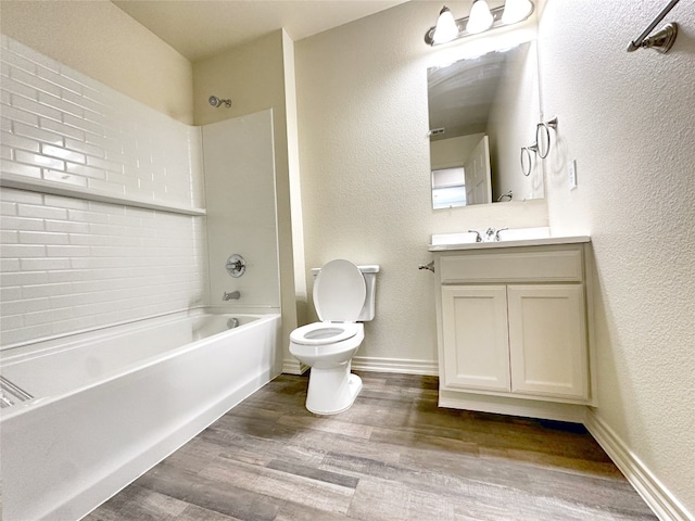 full bathroom with vanity, hardwood / wood-style floors, bathtub / shower combination, and toilet