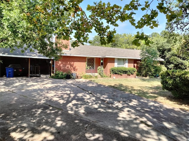 ranch-style home featuring a carport