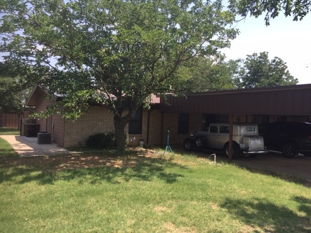 view of yard with central AC