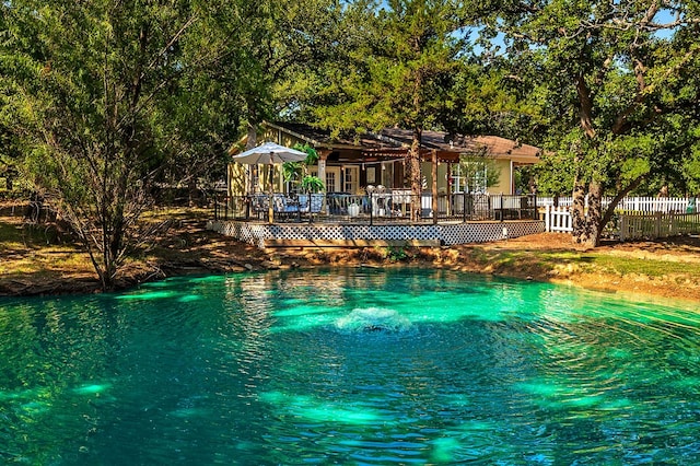 view of pool with a pergola and a wooden deck