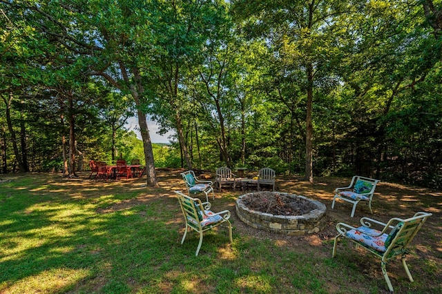 view of yard with an outdoor fire pit