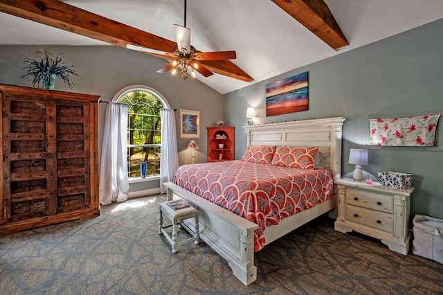 bedroom featuring dark colored carpet, ceiling fan, and vaulted ceiling with beams