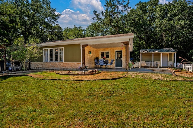 view of front of house with a front lawn and a patio area