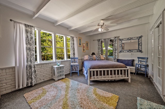 carpeted bedroom featuring ceiling fan, beamed ceiling, and multiple windows