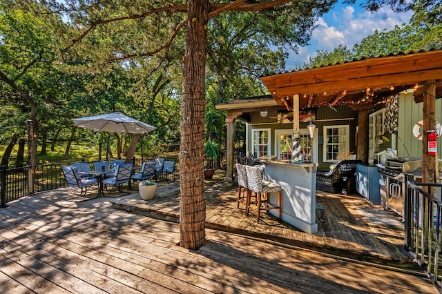 wooden deck featuring a pergola