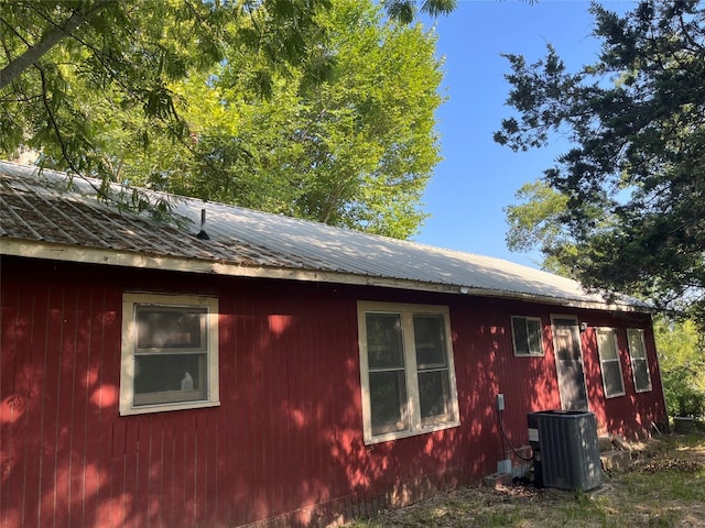 view of side of home featuring central AC unit