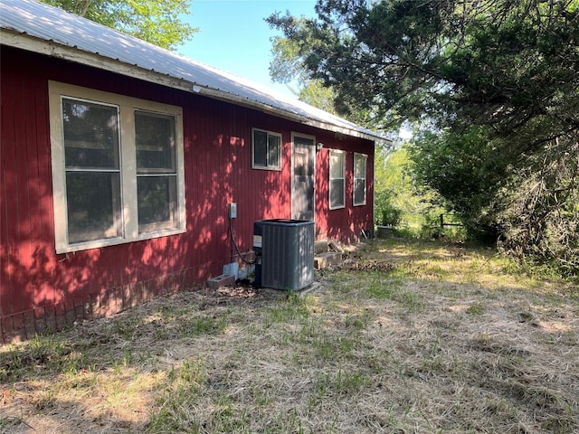 view of property exterior with central AC