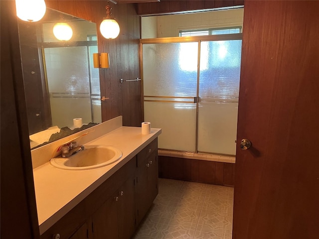 bathroom featuring shower / bath combination with glass door, vanity, and tile flooring