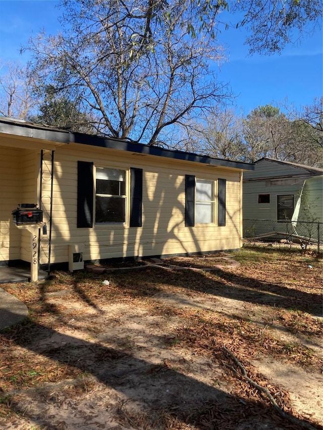 view of home's exterior with a carport