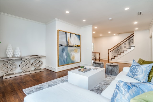 living room with ornamental molding and dark wood-type flooring